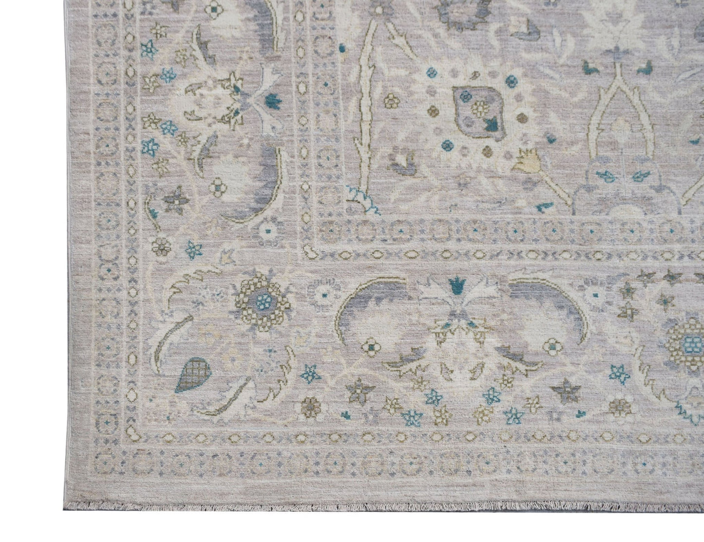 A handwoven Afghan Balkh rug featuring traditional floral patterns in soft neutral tones.