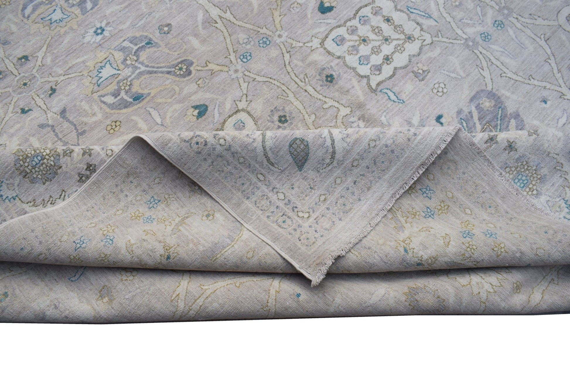 A handwoven Afghan Balkh rug featuring a traditional floral pattern in soft neutral tones.