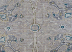 A handwoven Afghan Balkh rug featuring a traditional floral pattern in soft neutral tones.