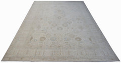 A handmade Afghan Balkh rug featuring a subtle, light-toned floral pattern on a wool pile.