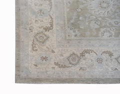 A handwoven Afghan Balkh rug featuring a traditional floral pattern in soft, neutral earth tones.
