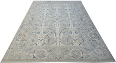A rectangular Afghan Balkh rug featuring a traditional floral pattern in soft blue and beige tones.