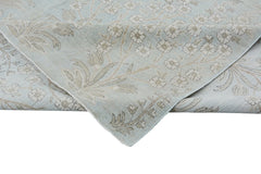 A handmade Afghan Balkh rug featuring a light blue field with a beige floral pattern.