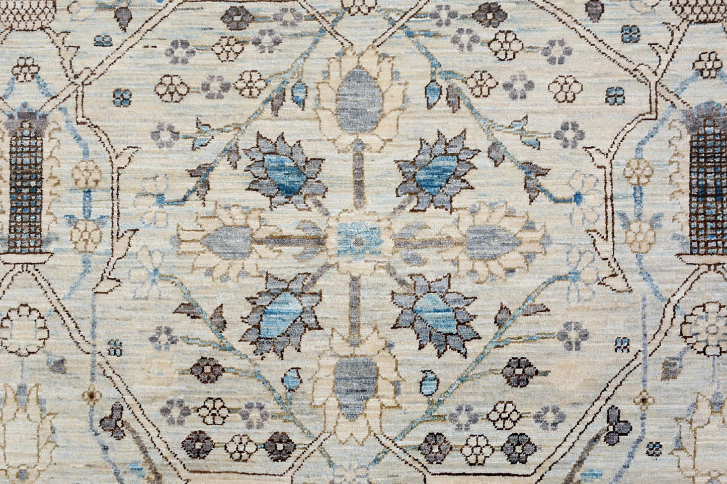 An Afghan Balkh rug featuring a traditional floral medallion pattern in blue and beige tones.