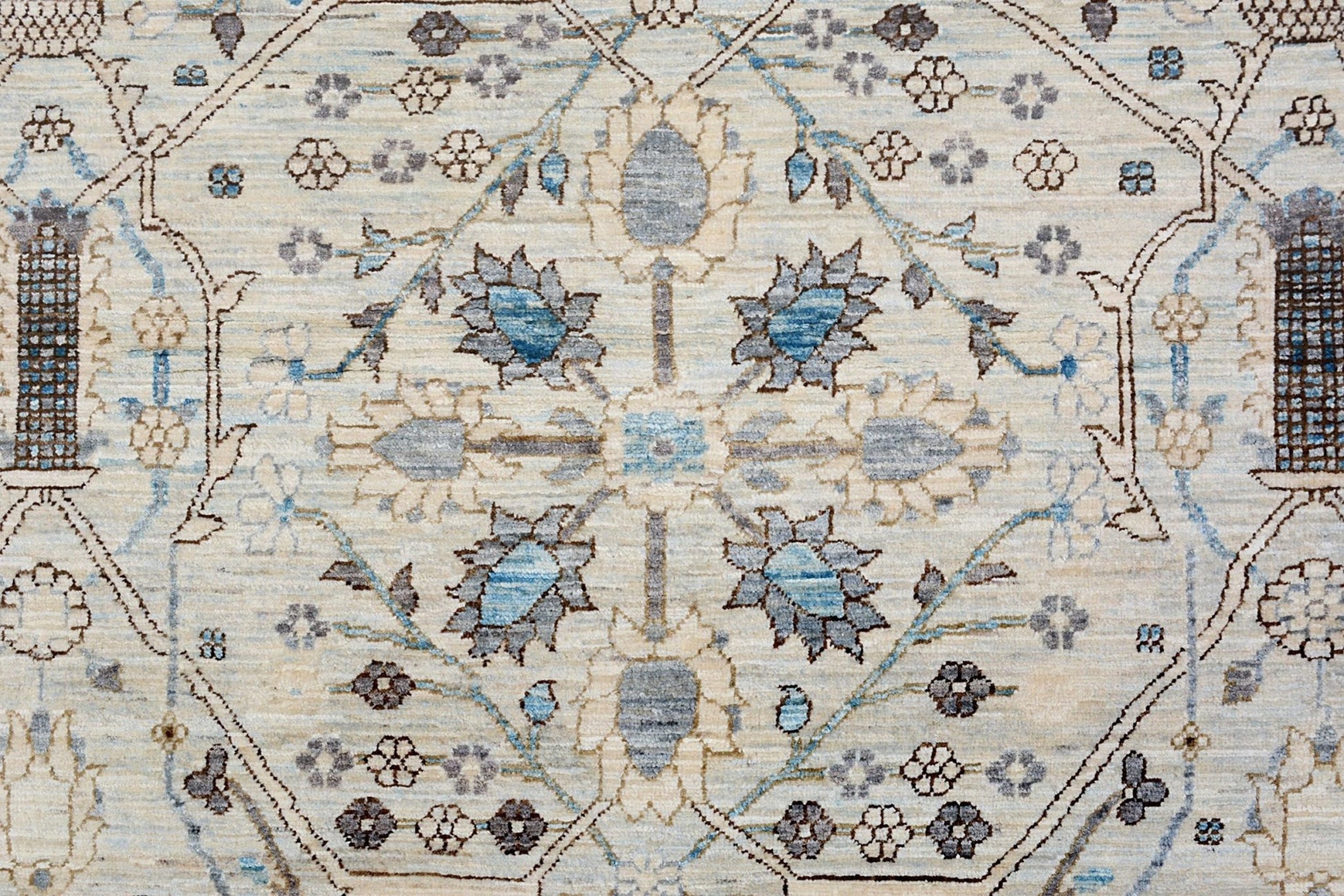 An Afghan Balkh rug featuring a traditional floral medallion pattern in blue and beige tones.