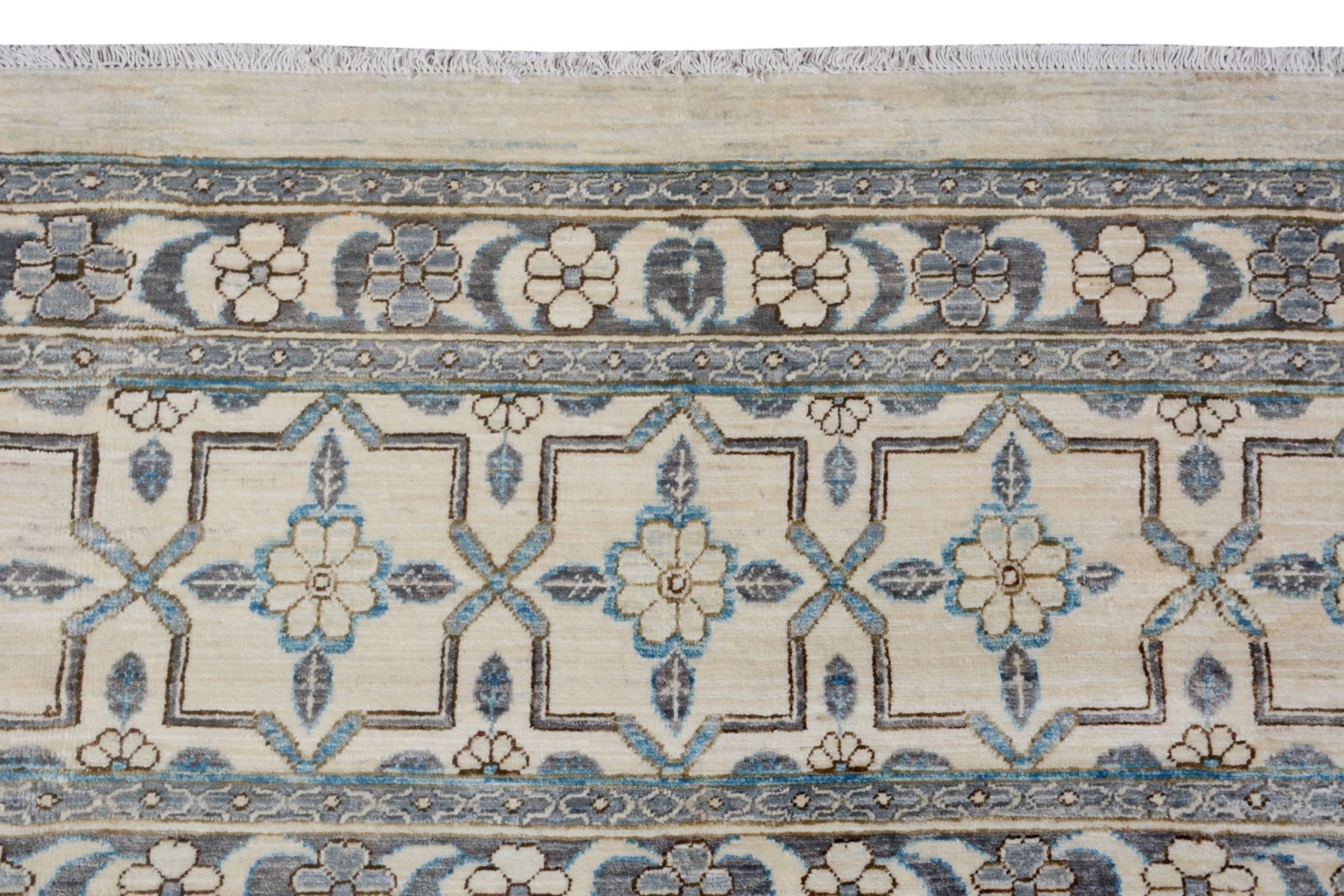 An Afghan Balkh rug featuring a cream field with blue and grey floral geometric patterns.