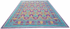 Handwoven Afghan Balkh rug featuring a vibrant floral pattern in purple, blue, and gold tones.