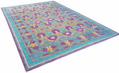 Handwoven Afghan Balkh rug featuring a floral pattern in purple, teal, and gold tones.