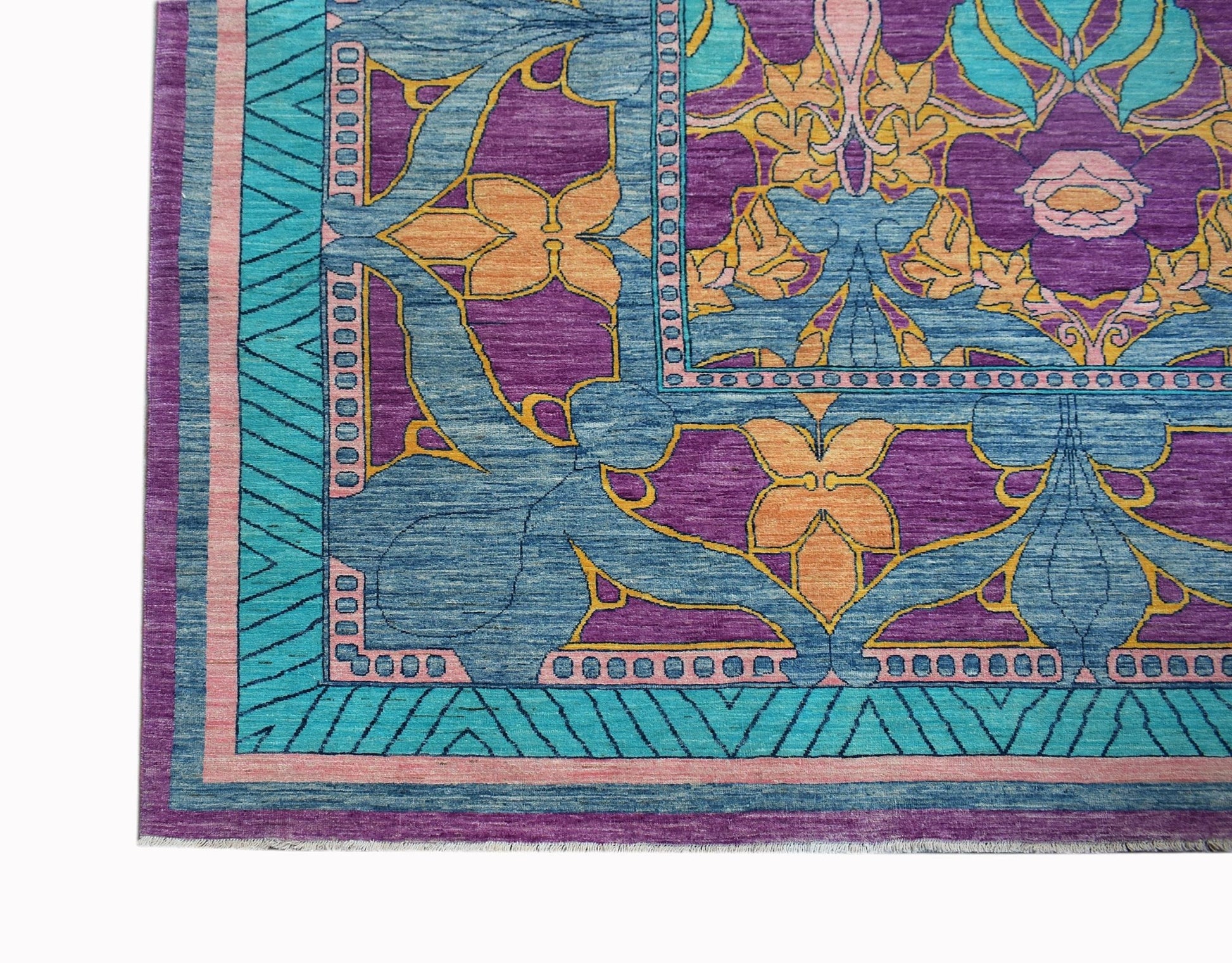 A handwoven Afghan Balkh rug featuring a vibrant floral pattern in purple, blue, and orange.