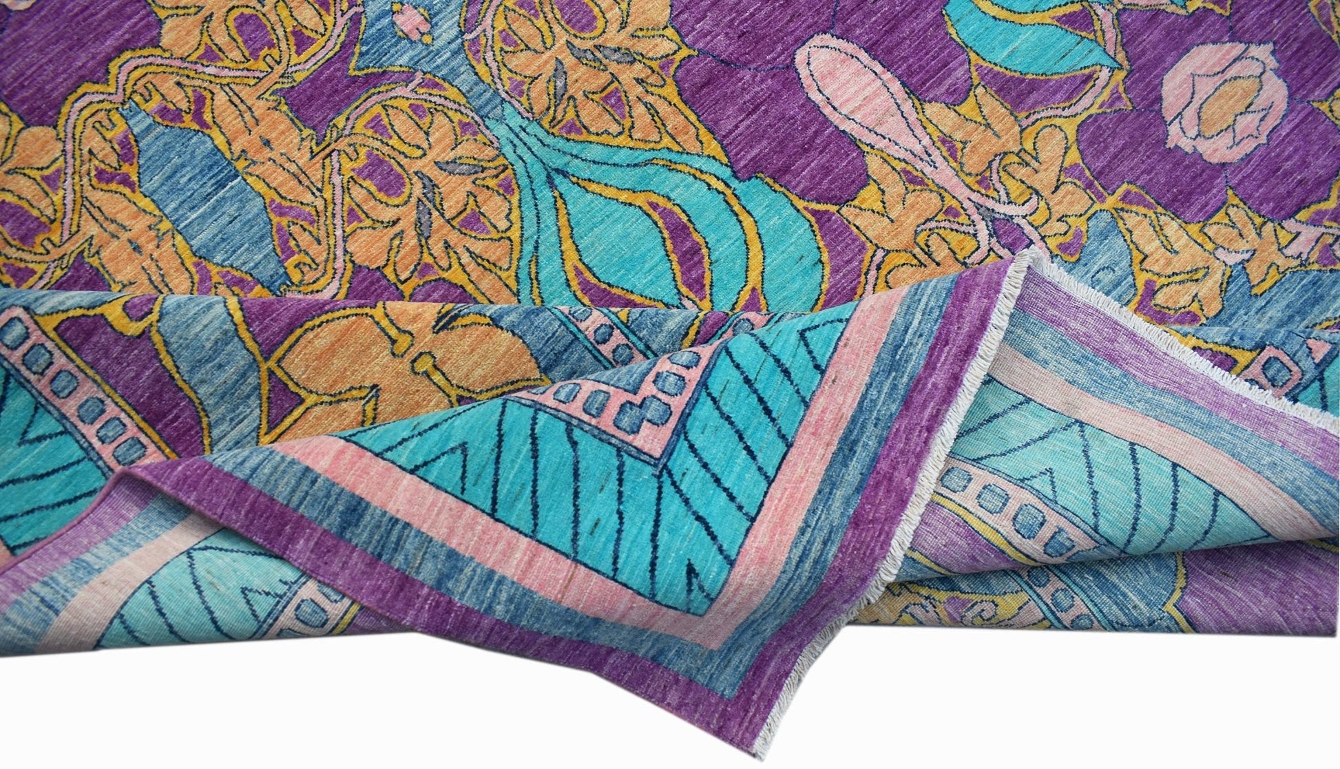 An Afghan Balkh rug featuring a vibrant floral pattern in purple, turquoise, and orange tones.