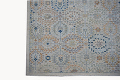 An Afghan Balkh rug featuring a traditional floral pattern in soft blue and earthy tones.