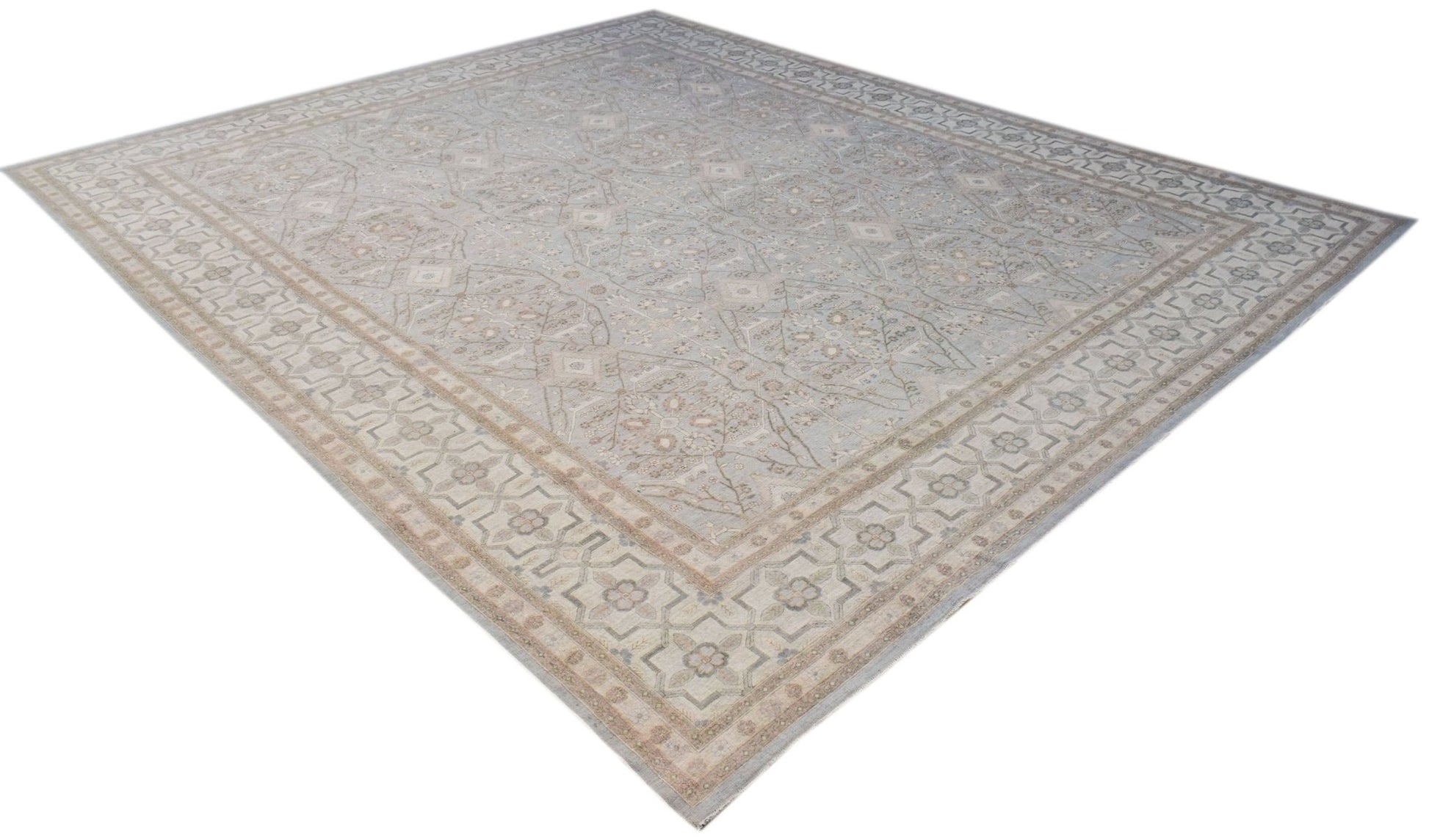 A large, rectangular Afghan Balkh rug featuring a traditional floral pattern in soft blue and beige.