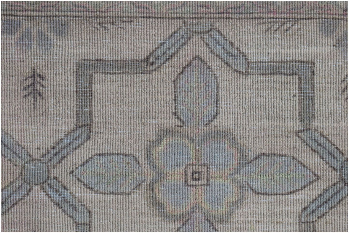 A close-up of a handwoven Afghan Balkh rug featuring a traditional geometric floral pattern.