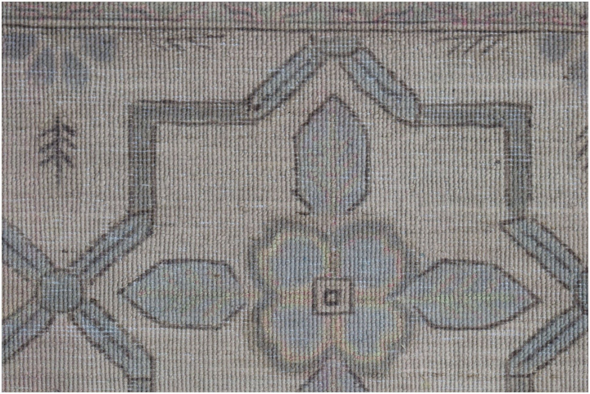 A close-up of a handwoven Afghan Balkh rug featuring a traditional geometric floral pattern.