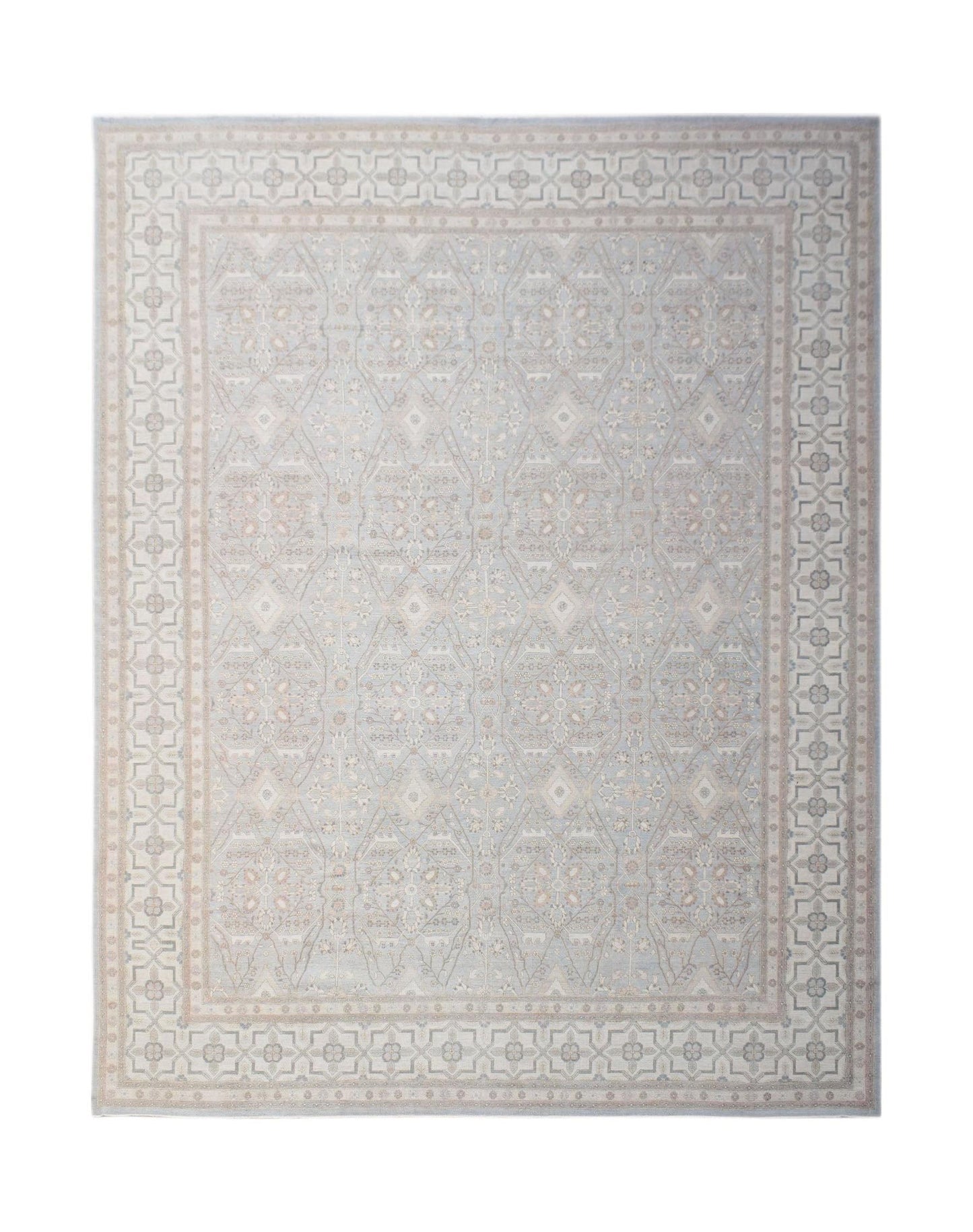 A handwoven Afghan Balkh rug featuring a traditional geometric pattern in soft blue and beige tones.