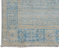 A handwoven Afghan Chobi runner featuring a traditional blue and cream Mamluk medallion pattern.