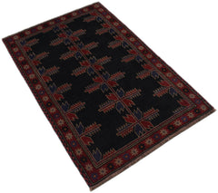 Handmade Afghan Baluch rug featuring a dark field with geometric red and blue tribal patterns.