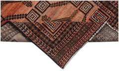 Handmade Afghan Baluch rug featuring geometric patterns in shades of orange, brown, and black.