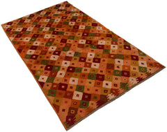 A handmade Afghan Baluch rug featuring a geometric pattern of multicolored squares in wool.