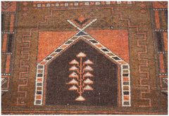 A handmade Afghan Baluch rug featuring a central tree motif within a geometric mihrab design.