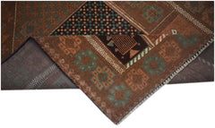 A handmade Afghan Baluch rug featuring geometric patterns in brown and teal wool.