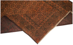Handmade Afghan Baluch rug featuring a geometric pattern in shades of brown and rust orange.