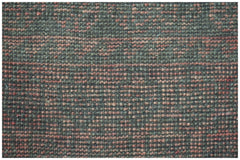 Close-up of a handmade Afghan Baluch rug featuring a textured pattern of dark brown and orange wool.