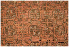 Handmade Afghan Baluch rug featuring a repeating geometric pattern in shades of orange and brown.