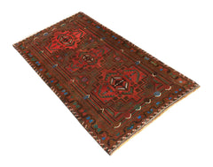 Handmade Afghan Pashm rug featuring a geometric tribal pattern in shades of red, brown, and blue.
