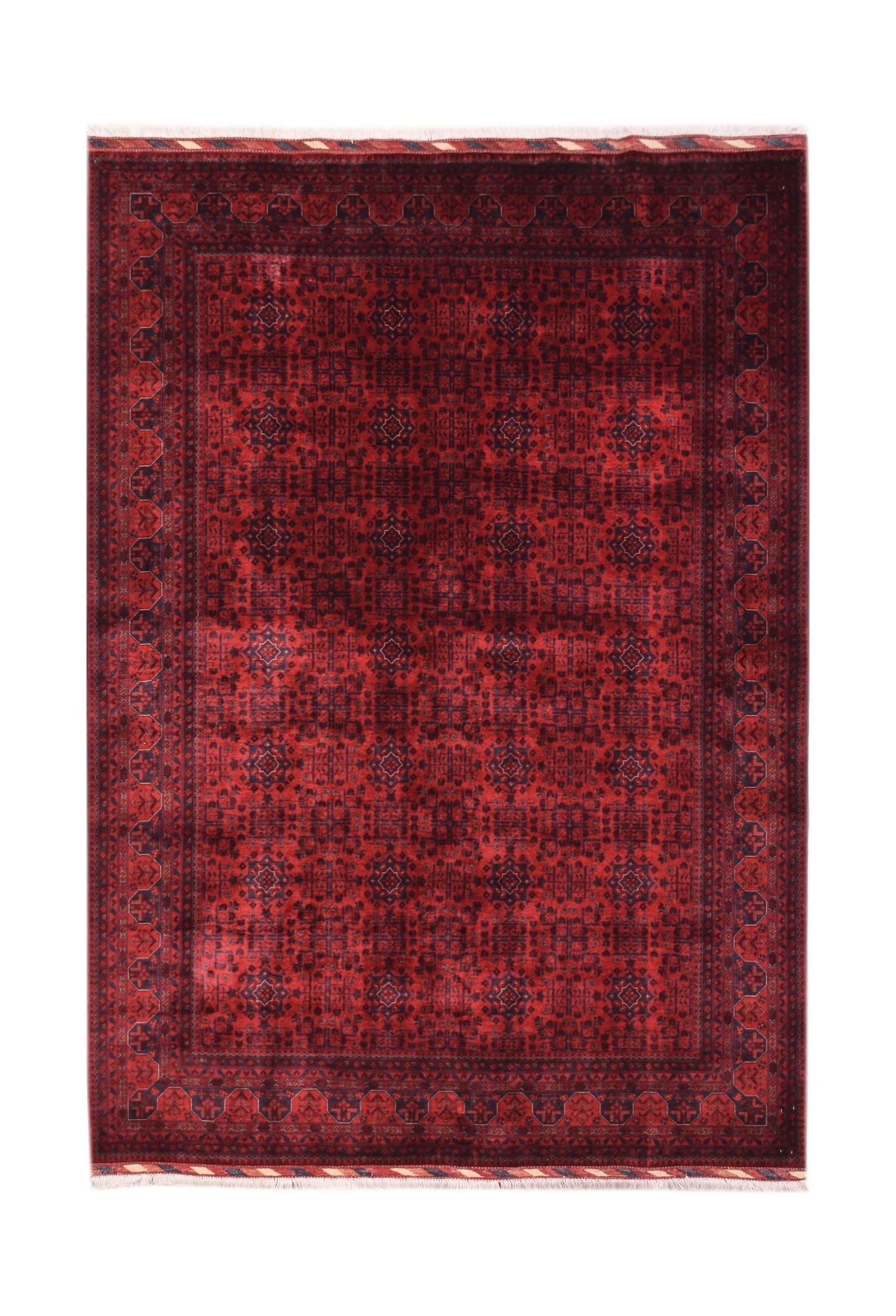 A handmade Afghan Biljik rug featuring a deep red field with intricate blue geometric patterns.