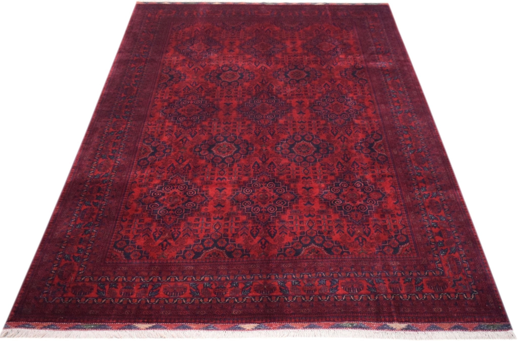 A handmade Afghan Biljik rug featuring a deep red field with intricate blue geometric patterns.