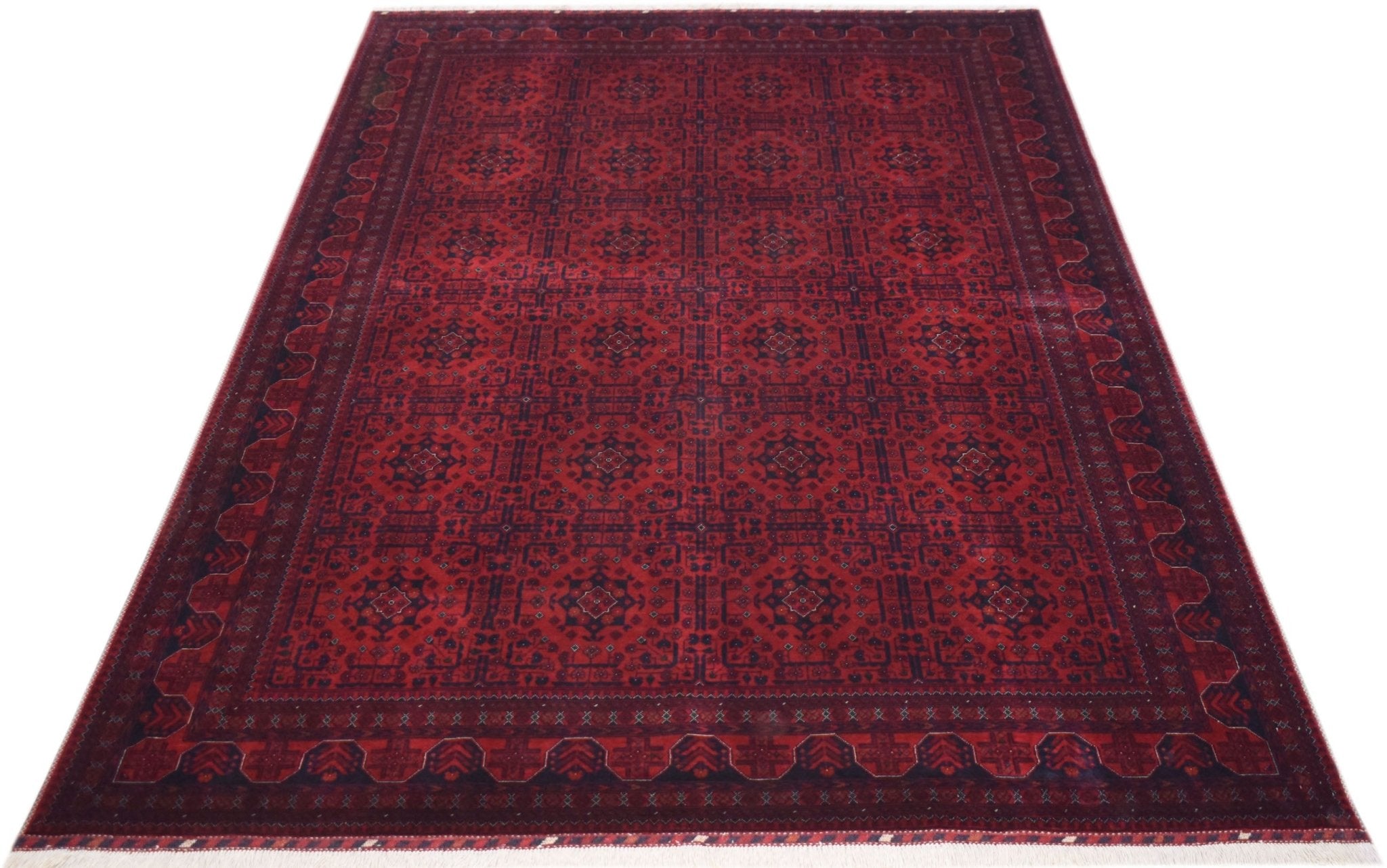 Handmade Afghan Biljik rug featuring a deep red field with intricate geometric patterns in blue.
