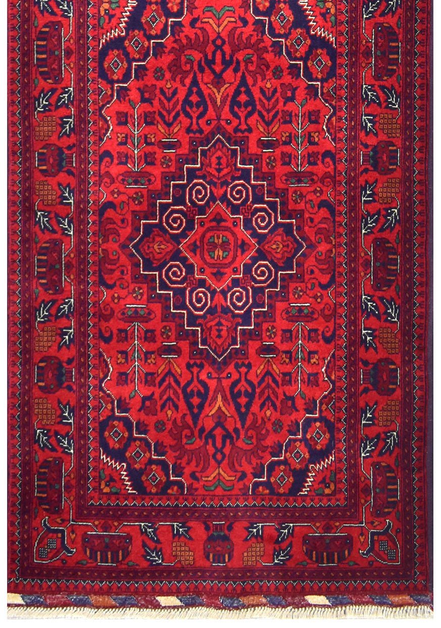 Handmade Afghan Biljik runner rug featuring a deep red field with intricate blue geometric motifs.