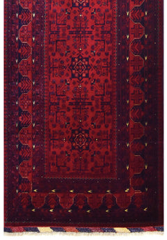 A handmade Afghan Biljik runner featuring deep red tones and intricate blue geometric patterns.