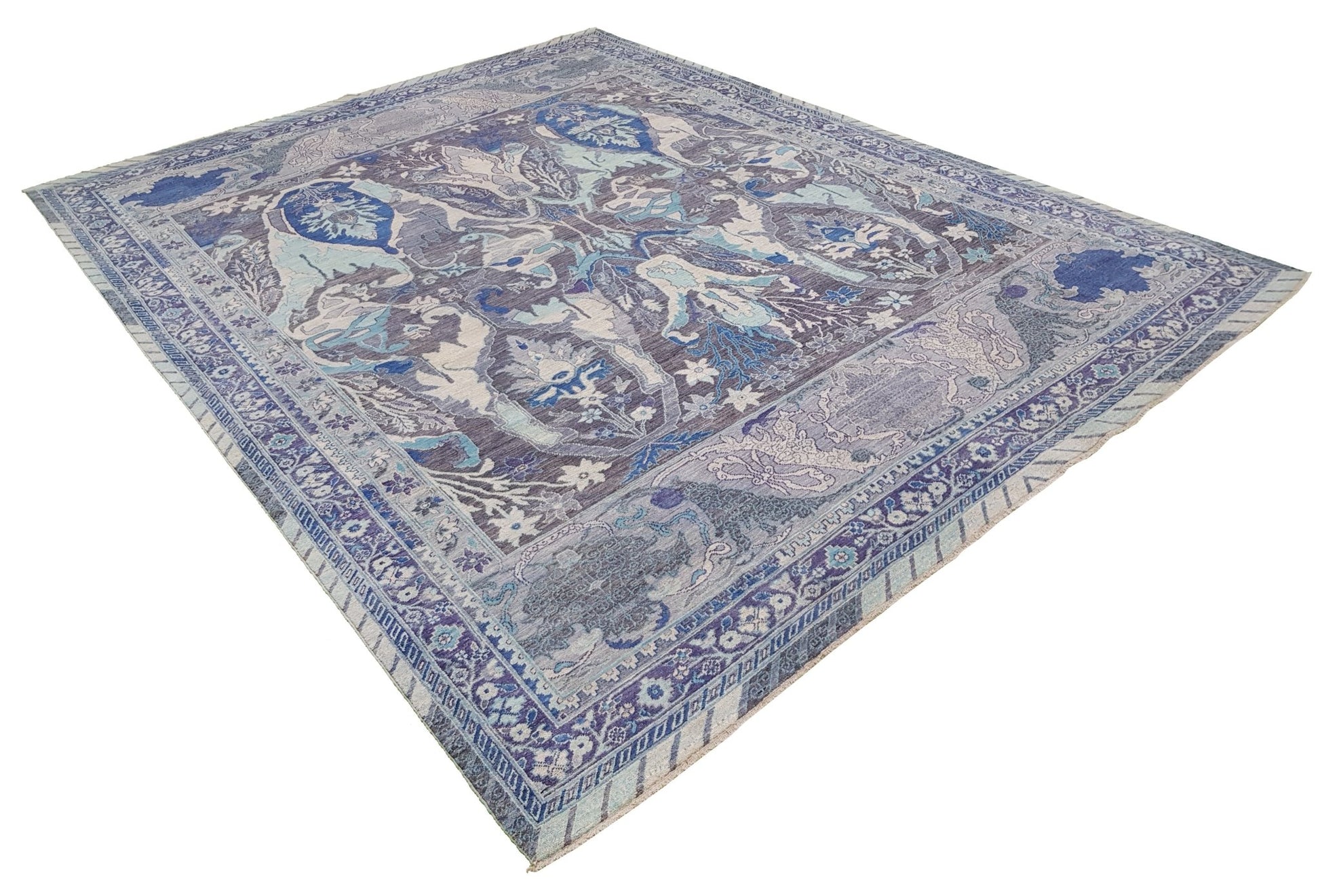 A handwoven Afghan Chobi rug featuring traditional Bidjar patterns in shades of blue and grey.