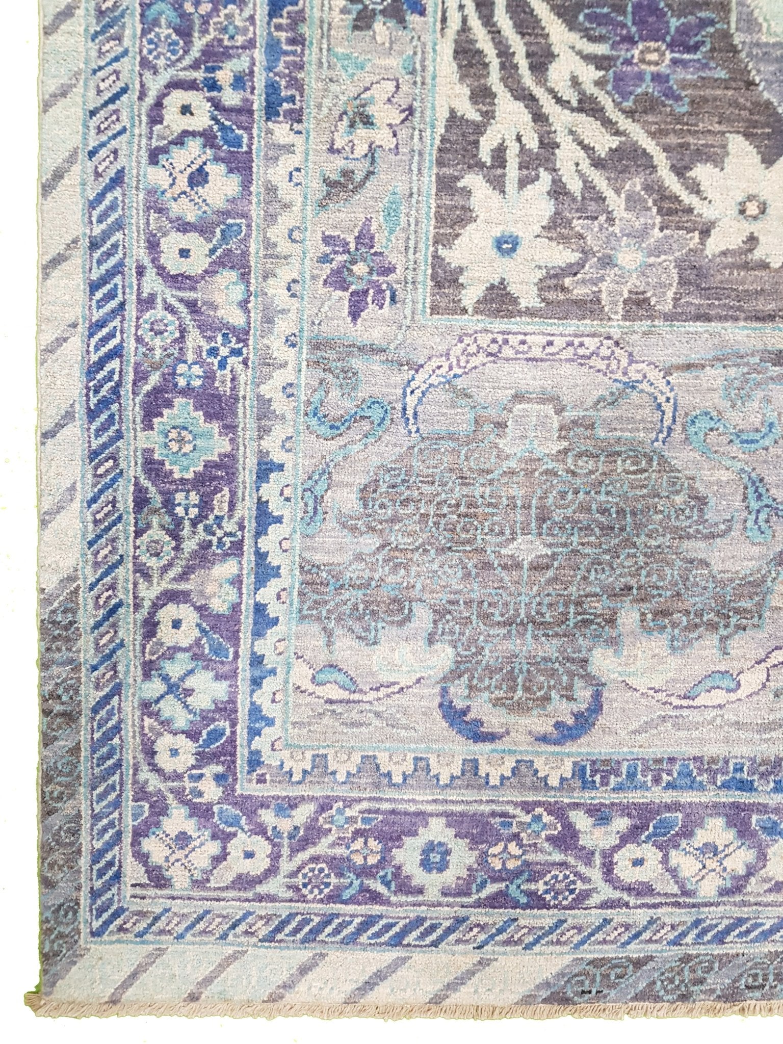 Handwoven Afghan Chobi rug featuring a traditional Bidjar pattern in shades of blue and purple.