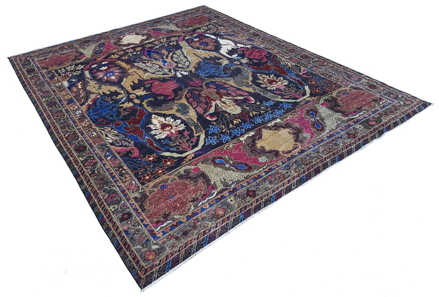A handwoven Afghan Chobi rug featuring a traditional Bidjar pattern in deep blue and red tones.