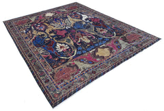 A handwoven Afghan Chobi rug featuring a traditional Bidjar pattern in deep blue and red tones.