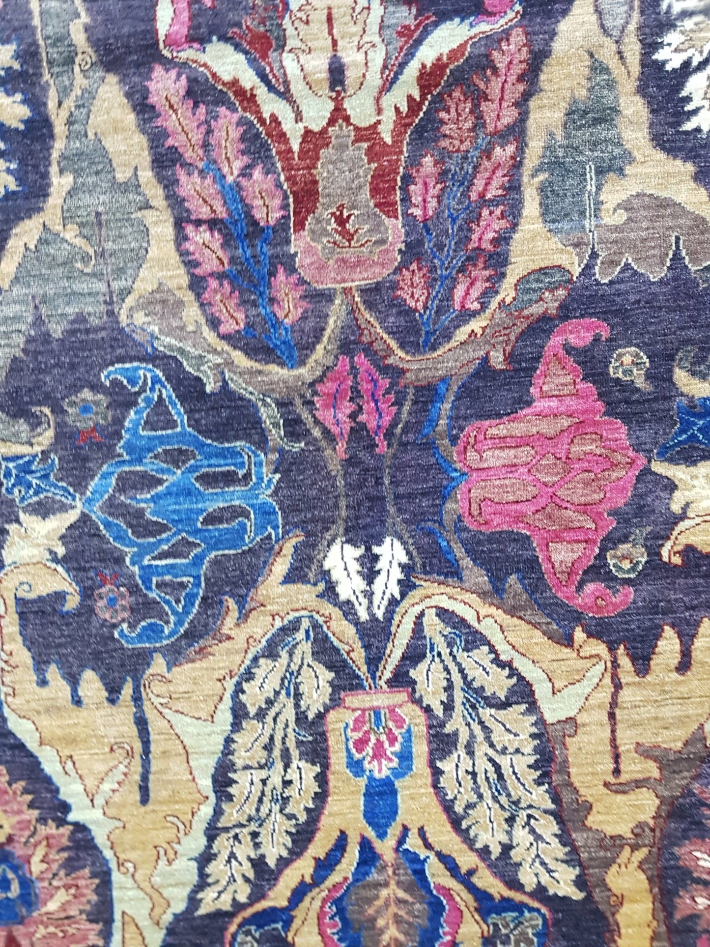 Handwoven Afghan Chobi rug featuring a traditional Bidjar pattern in deep blue and earthy tones.