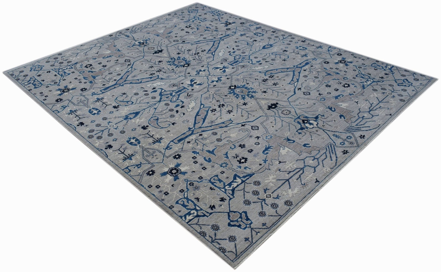 An Afghan Chobi rug featuring a traditional Bidjar pattern in shades of blue and grey.