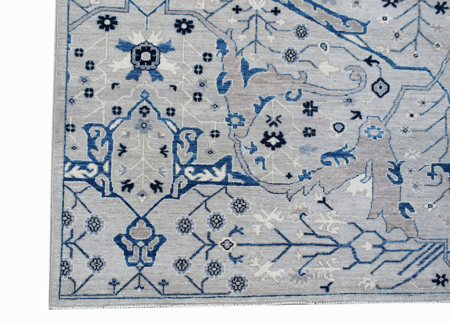 A handmade Afghan Chobi rug featuring a traditional Bidjar pattern in shades of blue and grey.