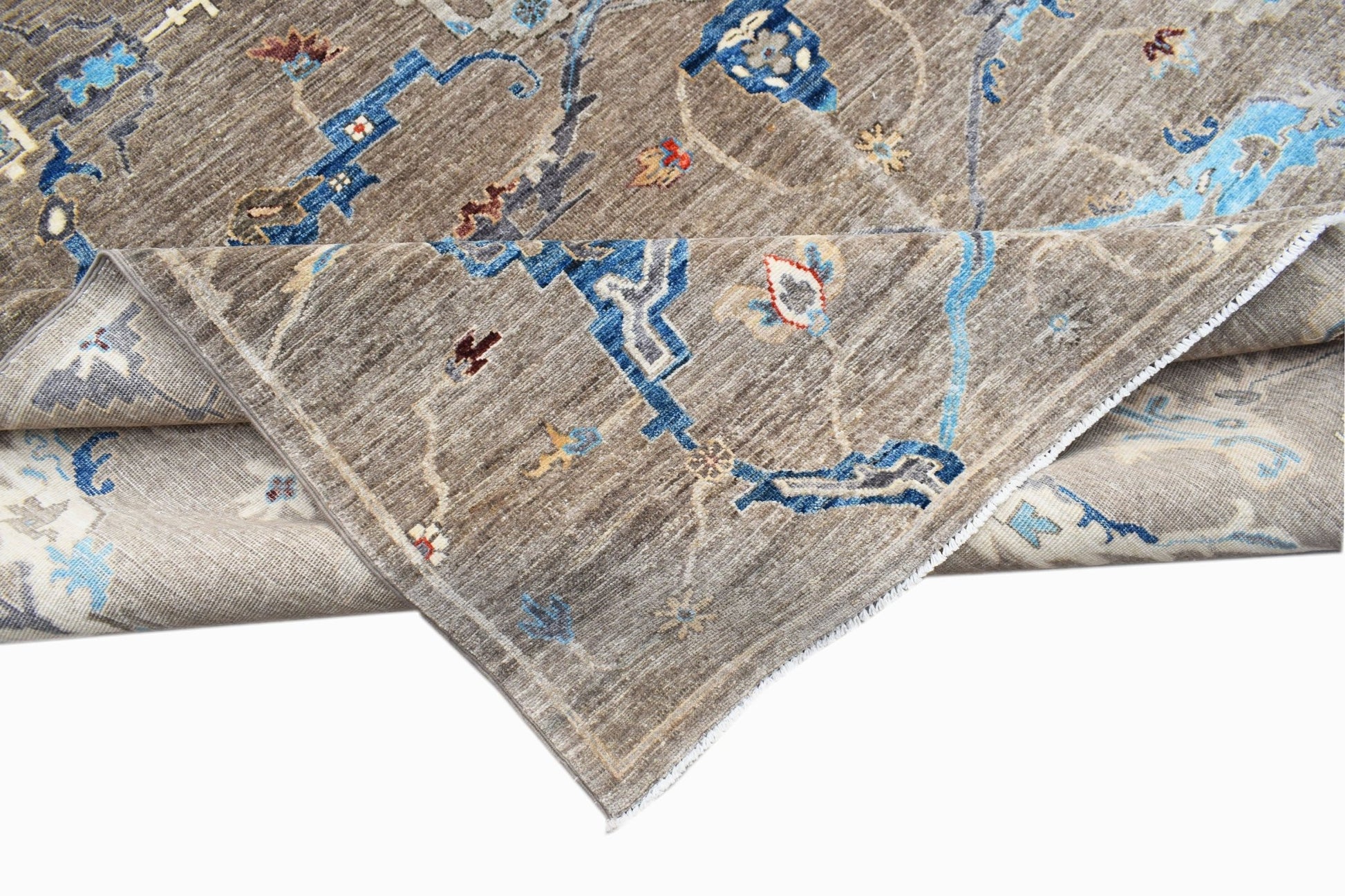 A handwoven Afghan Chobi rug featuring a traditional Bidjar pattern in brown and blue tones.