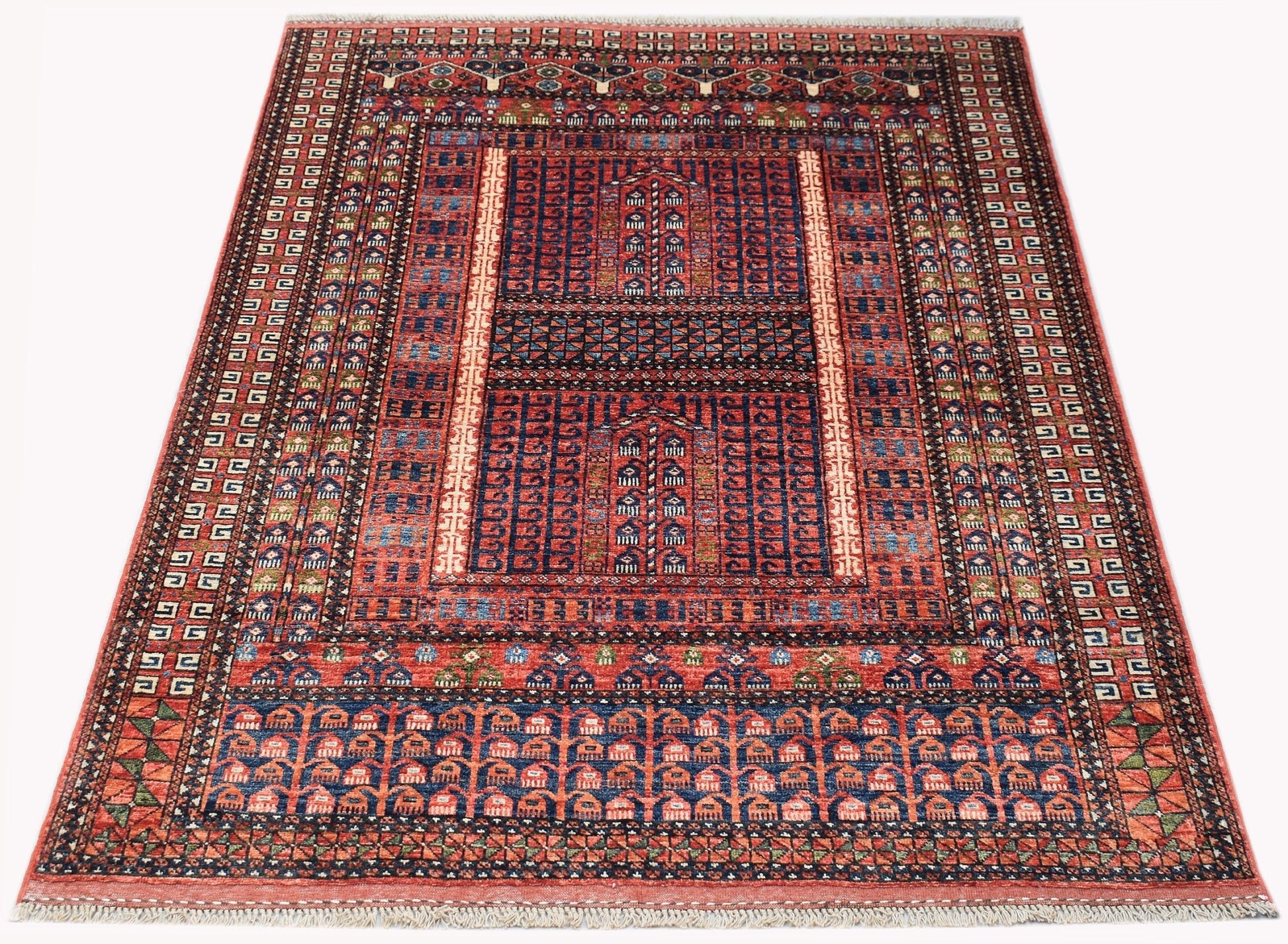 A handmade Afghan Chobi rug featuring a traditional red and blue geometric Engsi design.