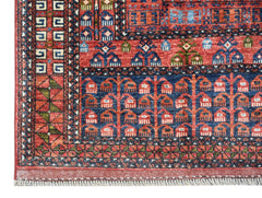 A handwoven Afghan Chobi rug featuring a traditional red and blue geometric Engsi pattern.