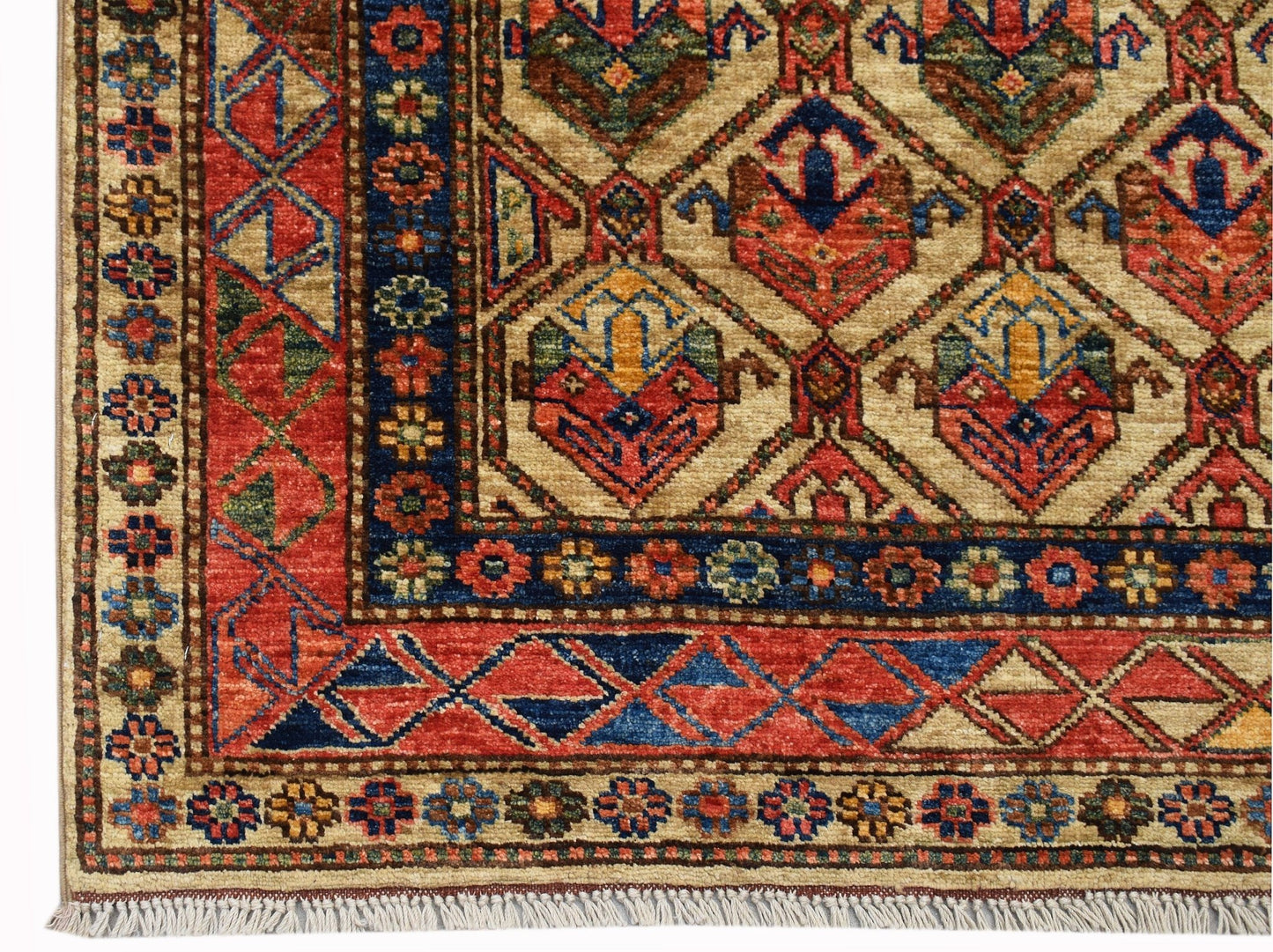 Handwoven Afghan Chobi rug featuring a geometric pattern in red, blue, and ivory with fringe.
