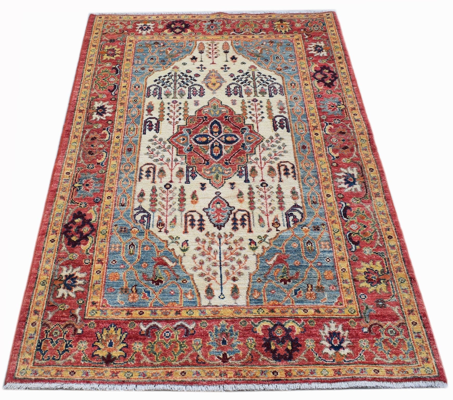 Handwoven Afghan Chobi rug featuring a traditional Heriz pattern in red, blue, and cream tones.