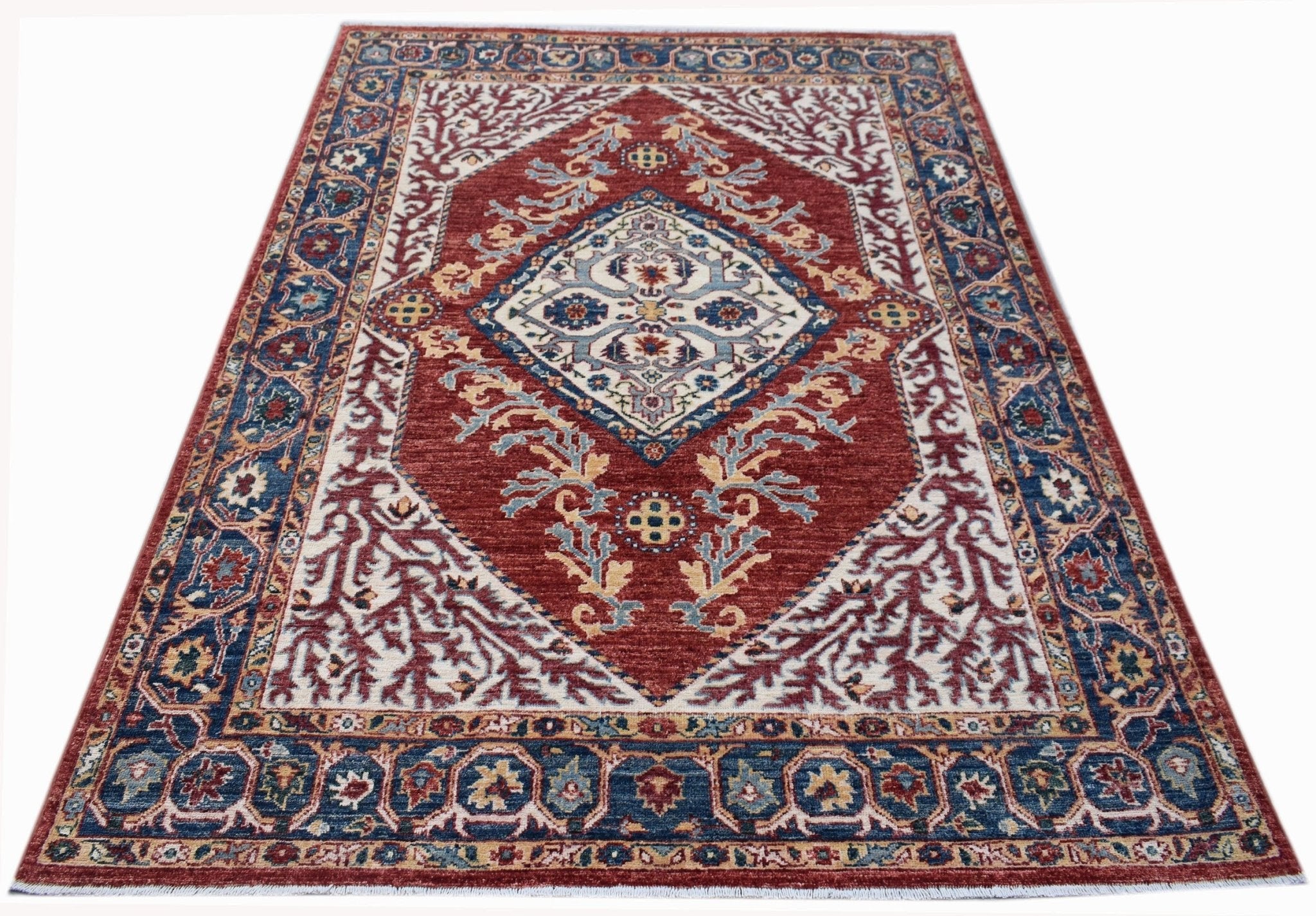 Handwoven Afghan Chobi rug featuring a traditional Heriz-style geometric pattern in red and blue.