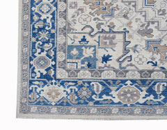 A handmade Afghan Chobi rug featuring a traditional Heriz pattern in blue, beige, and grey tones.