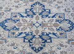 A handwoven Afghan Chobi rug featuring a traditional Heriz pattern in blue, beige, and grey.