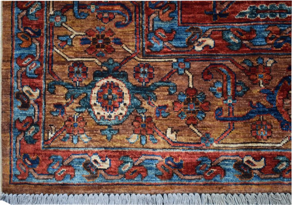 Handmade Afghan Chobi rug featuring a geometric Heriz pattern in rust, blue, and brown tones.